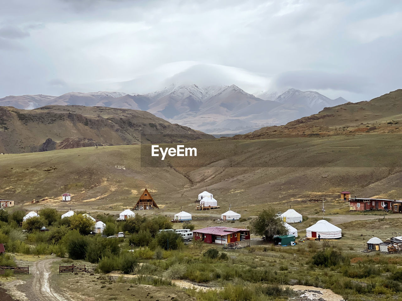 Yurt village against the snow-capped peaks in the southern part of altai, russia