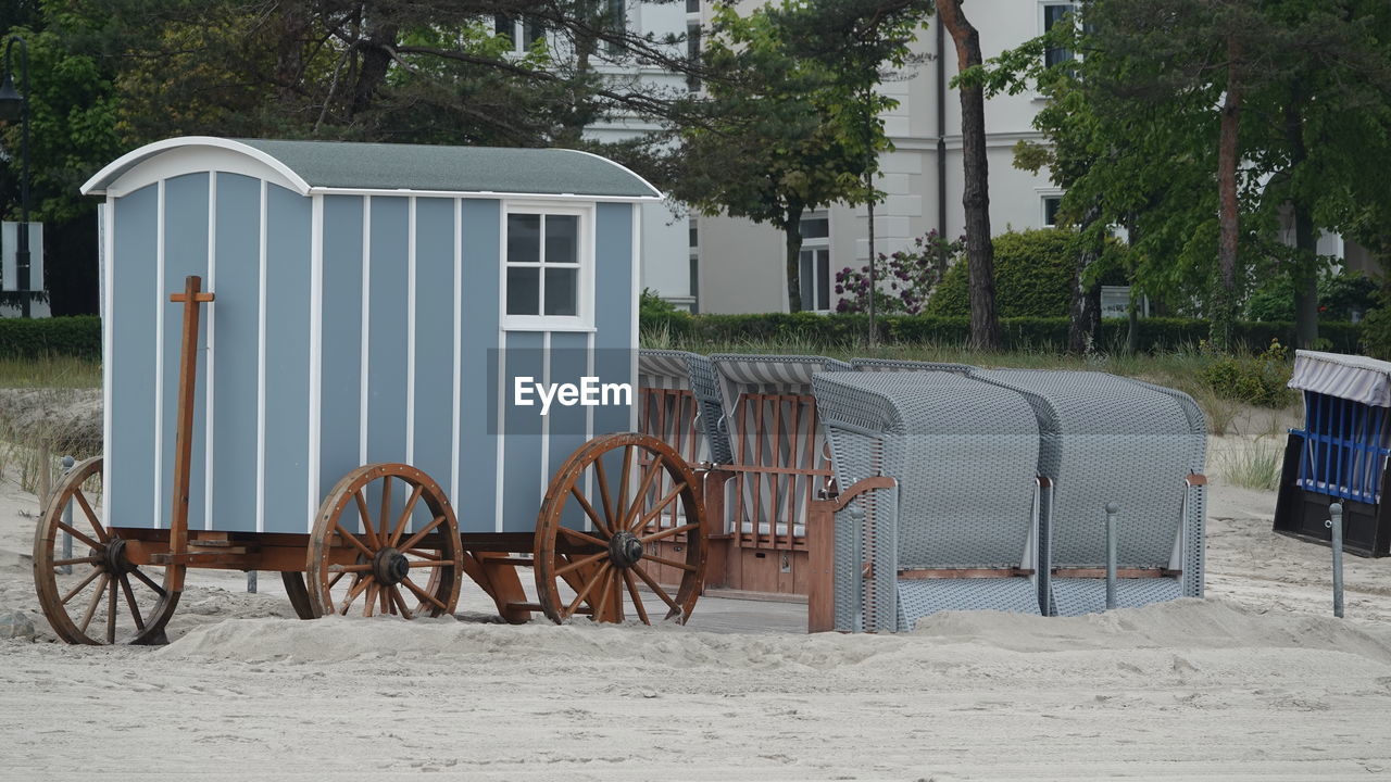 plant, tree, architecture, nature, no people, built structure, land, day, seat, beach, outdoors, chair, sand, transportation, building exterior, wood