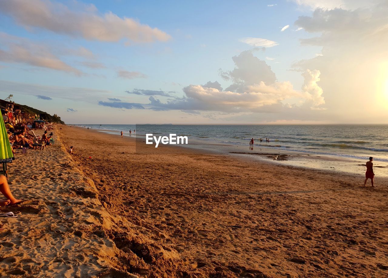 Scenic view of beach against sky during sunset