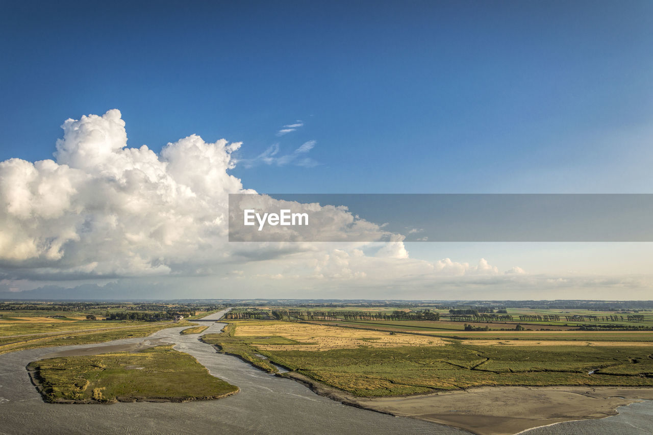 High angle view of landscape at walls of mont saint michel against cloudy sky