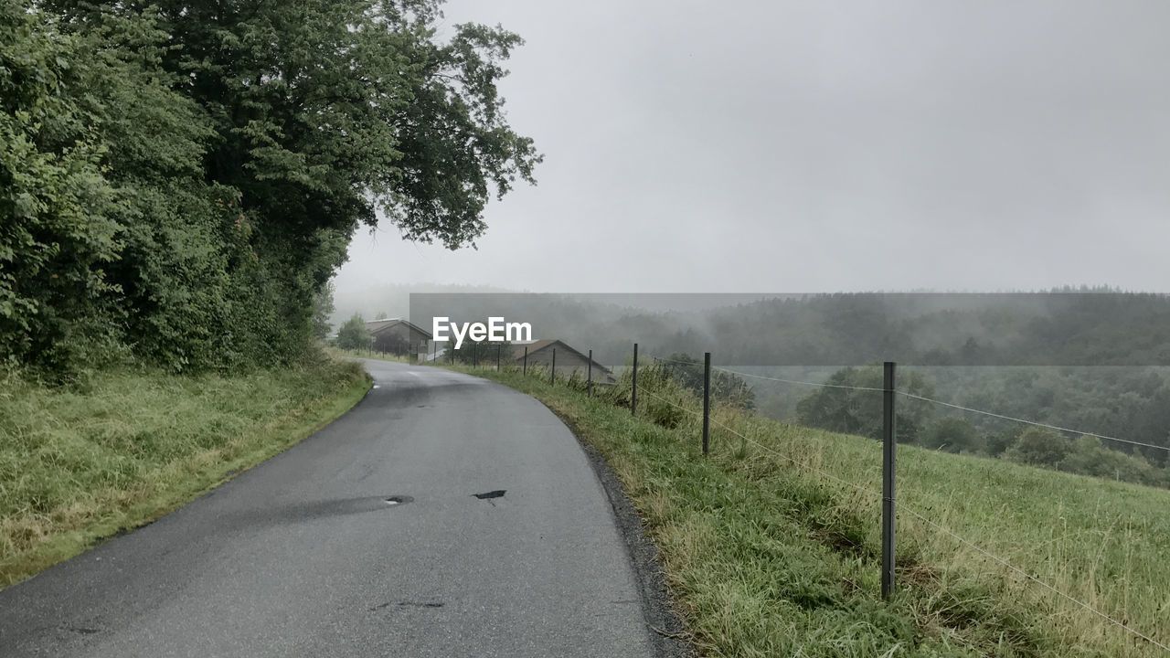 ROAD PASSING THROUGH LANDSCAPE