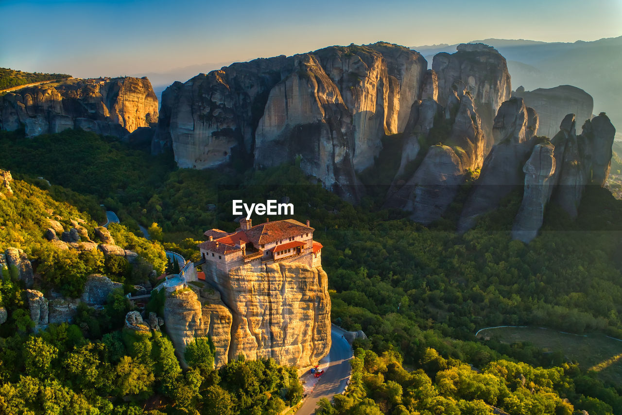 Aerial view of house on rock formation