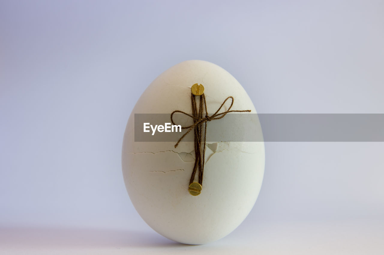 Close-up of easter eggs on table against white background