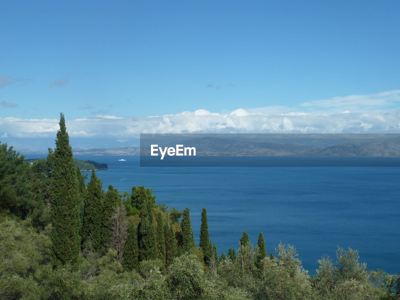 Scenic view of sea against blue sky