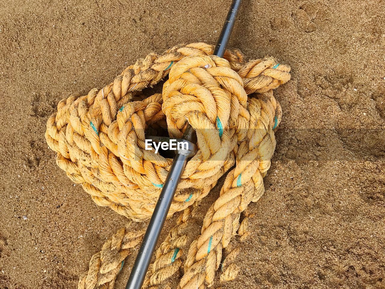 High angle view of rope tied on wood