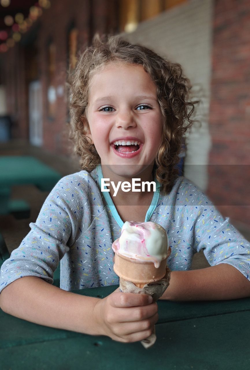 Portrait of smiling girl holding ice cream