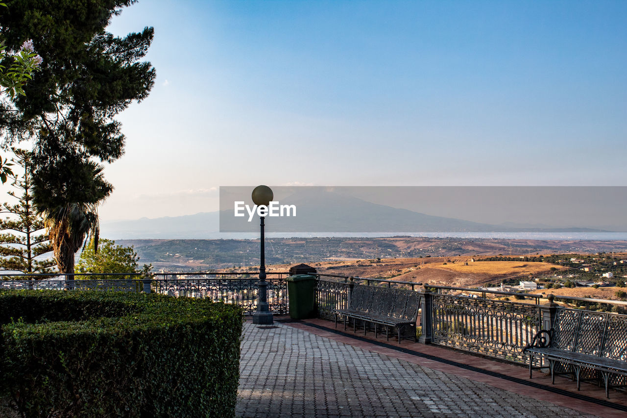 Scenic view of landscape and etna volcano against sky