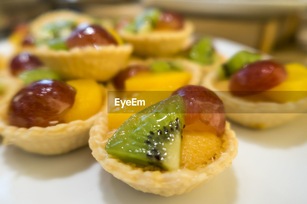 Close-up of fruit tarts on table