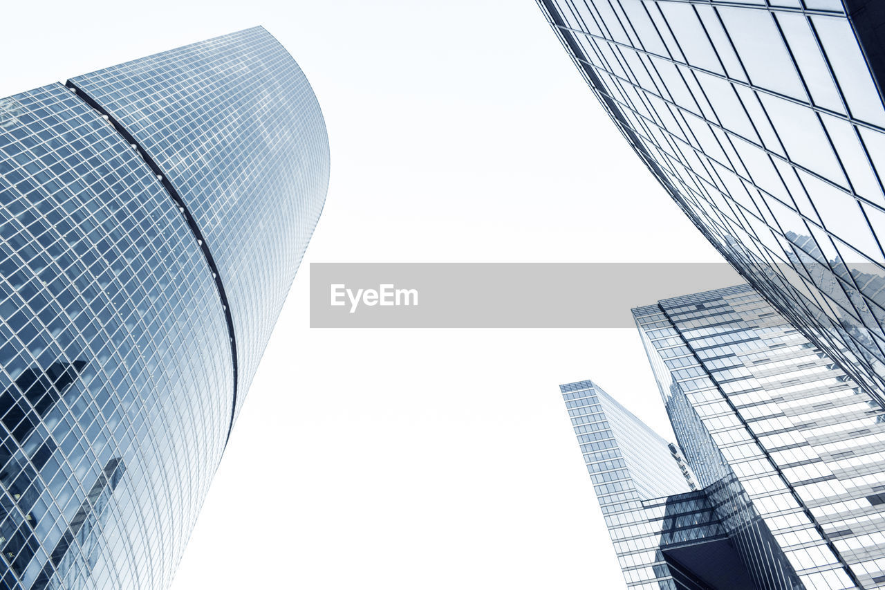 Low angle view of modern buildings against clear sky