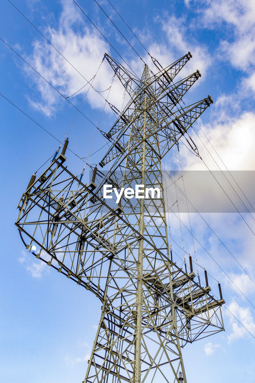 low angle view of electricity pylon against blue sky