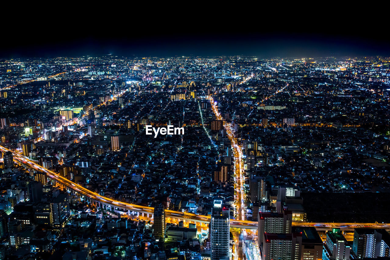 High angle view of illuminated cityscape at night