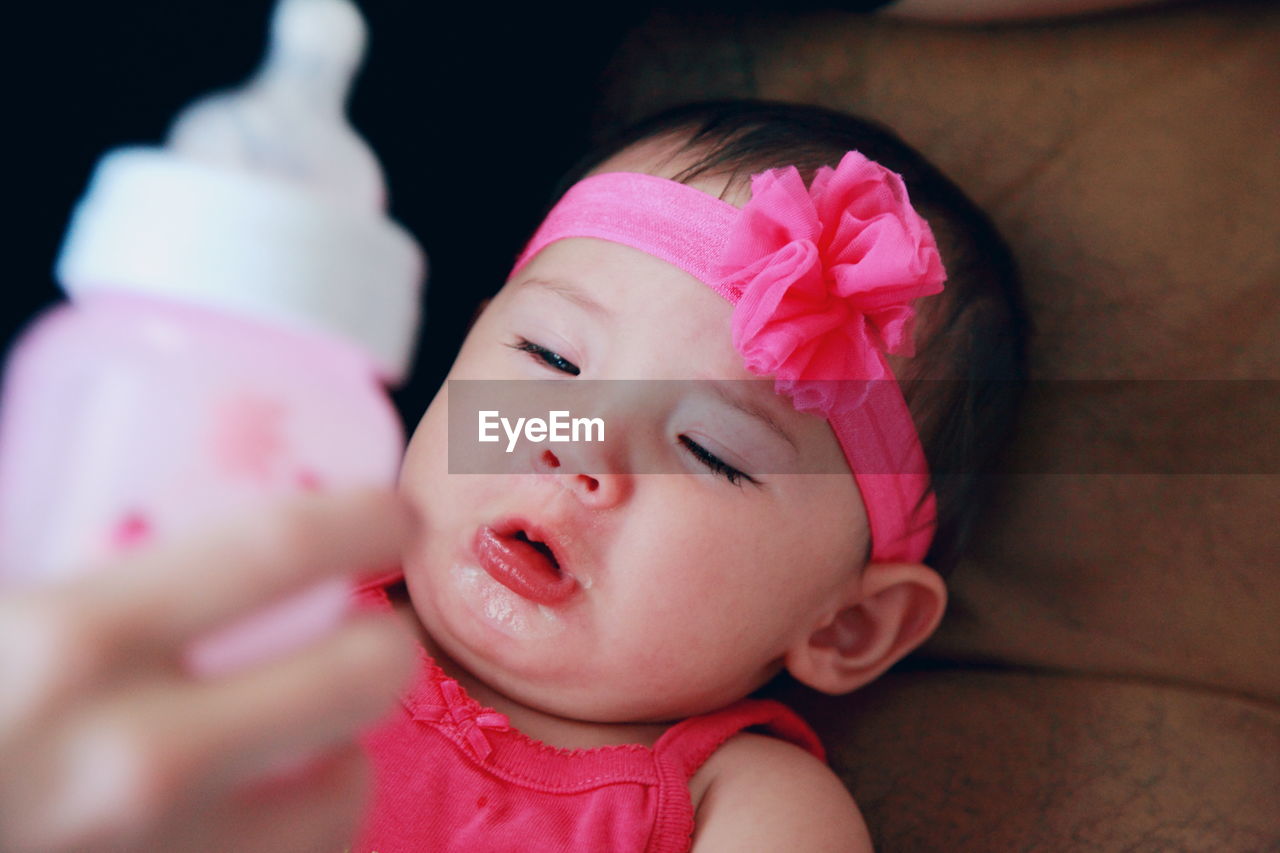 High angle view of girl crying at home