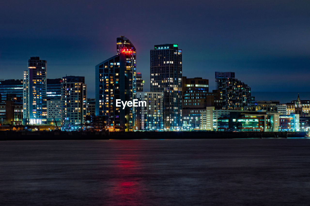 Illuminated buildings in city at night