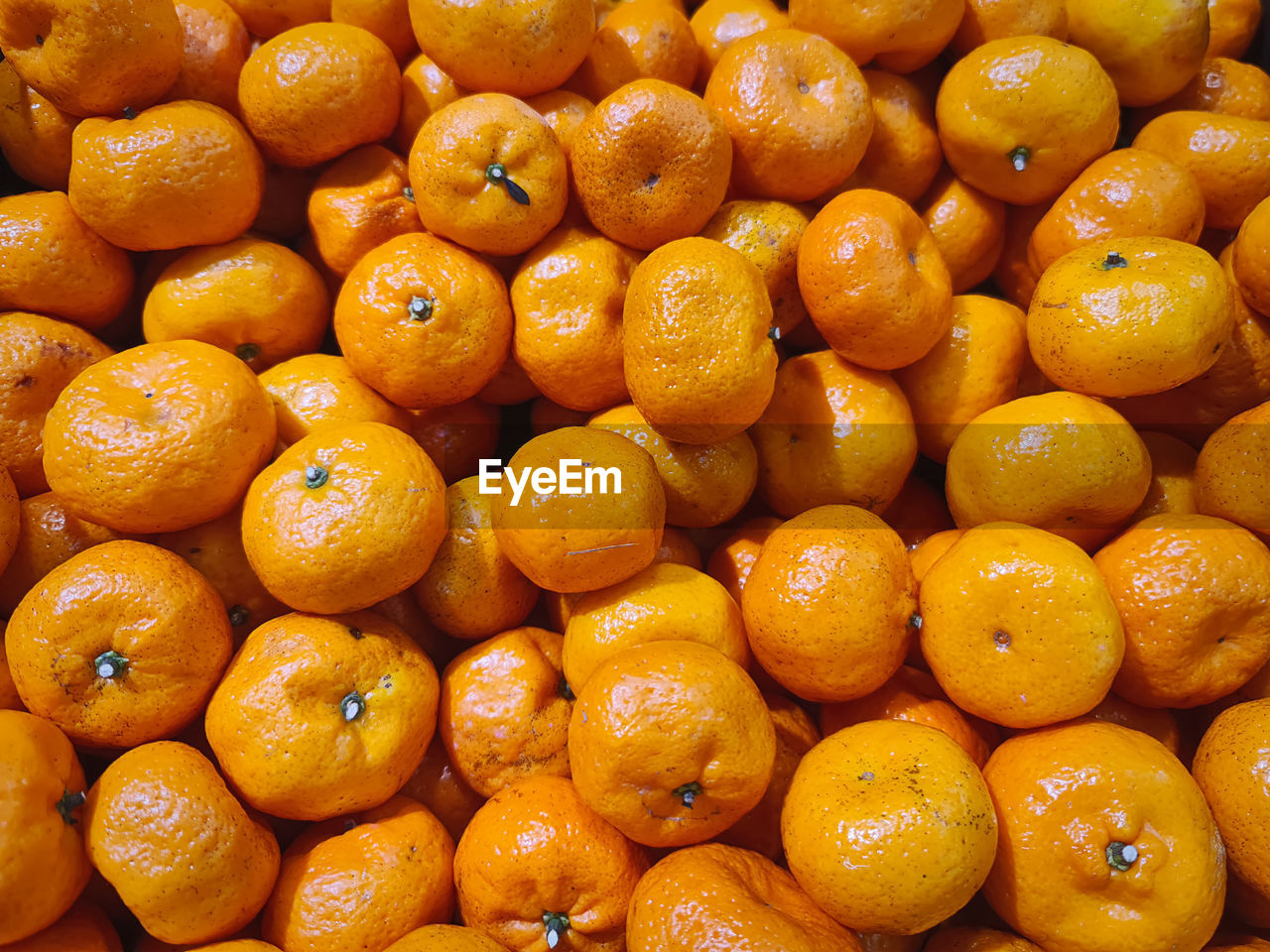 Full frame background of pile of orange fruits