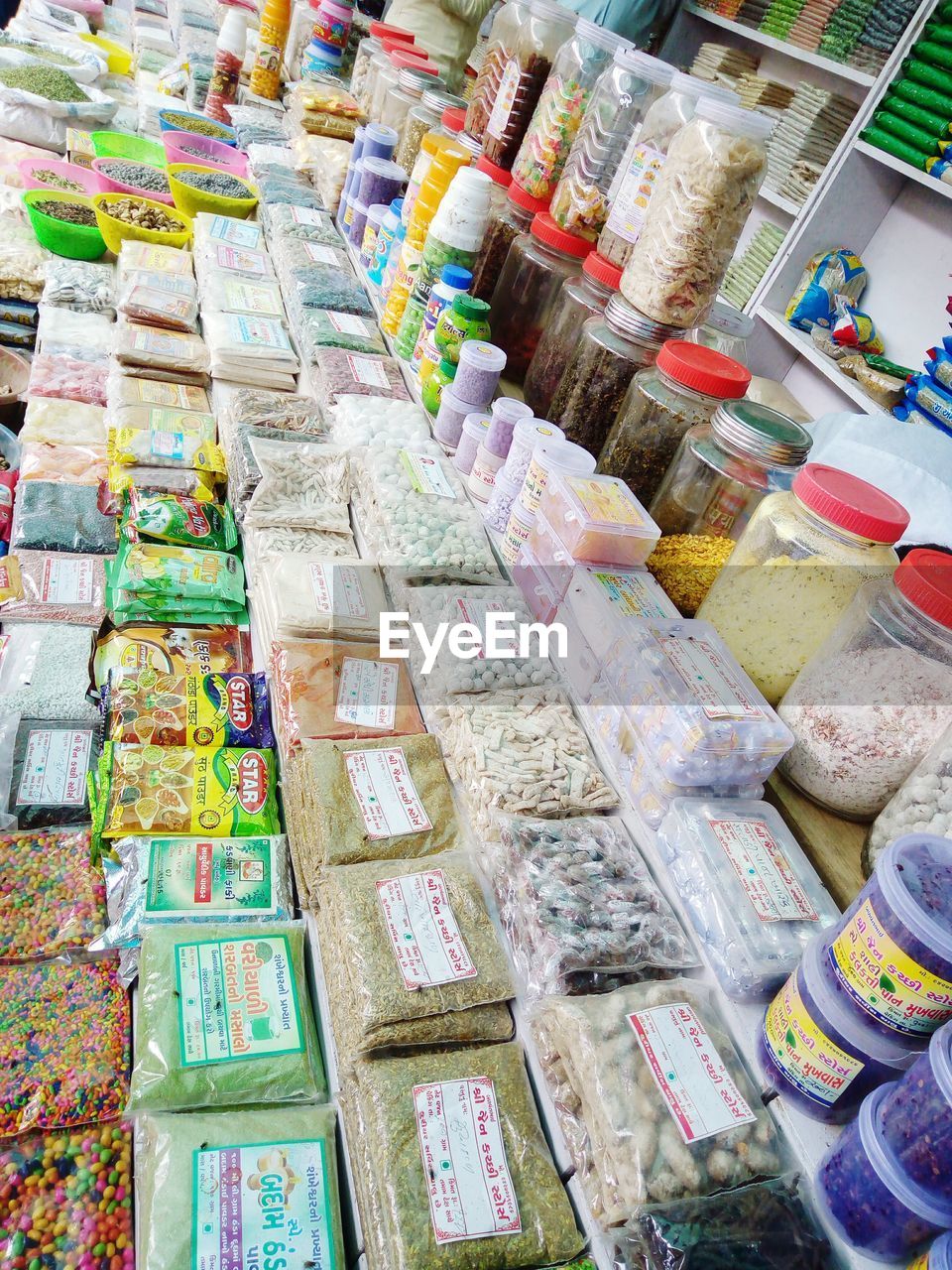 High angle view of food arranged in packets at market for sale