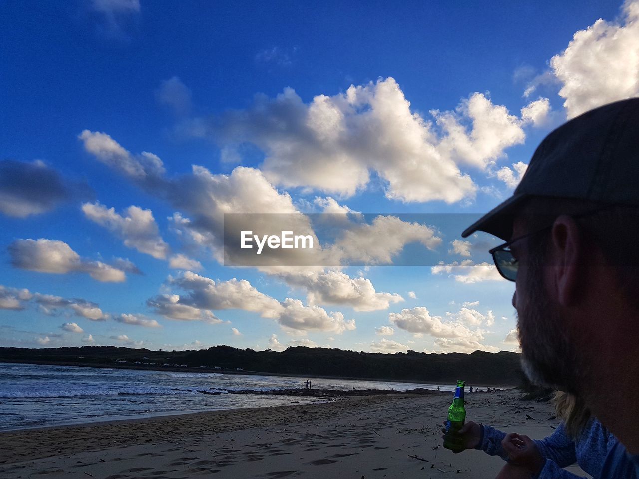 CLOSE-UP OF MAN AT BEACH