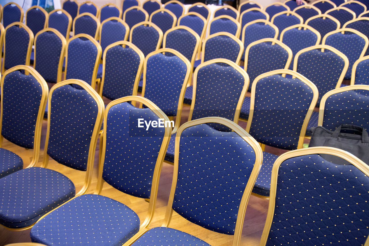 Full frame shot of empty chairs in stadium