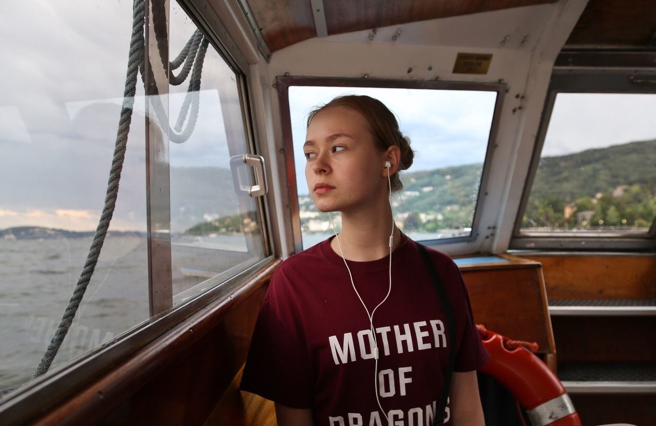 Close-up portrait of teenage girl on boat