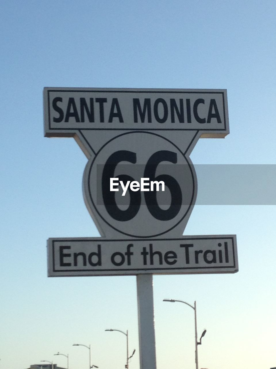 LOW ANGLE VIEW OF ROAD SIGNS AGAINST CLEAR SKY