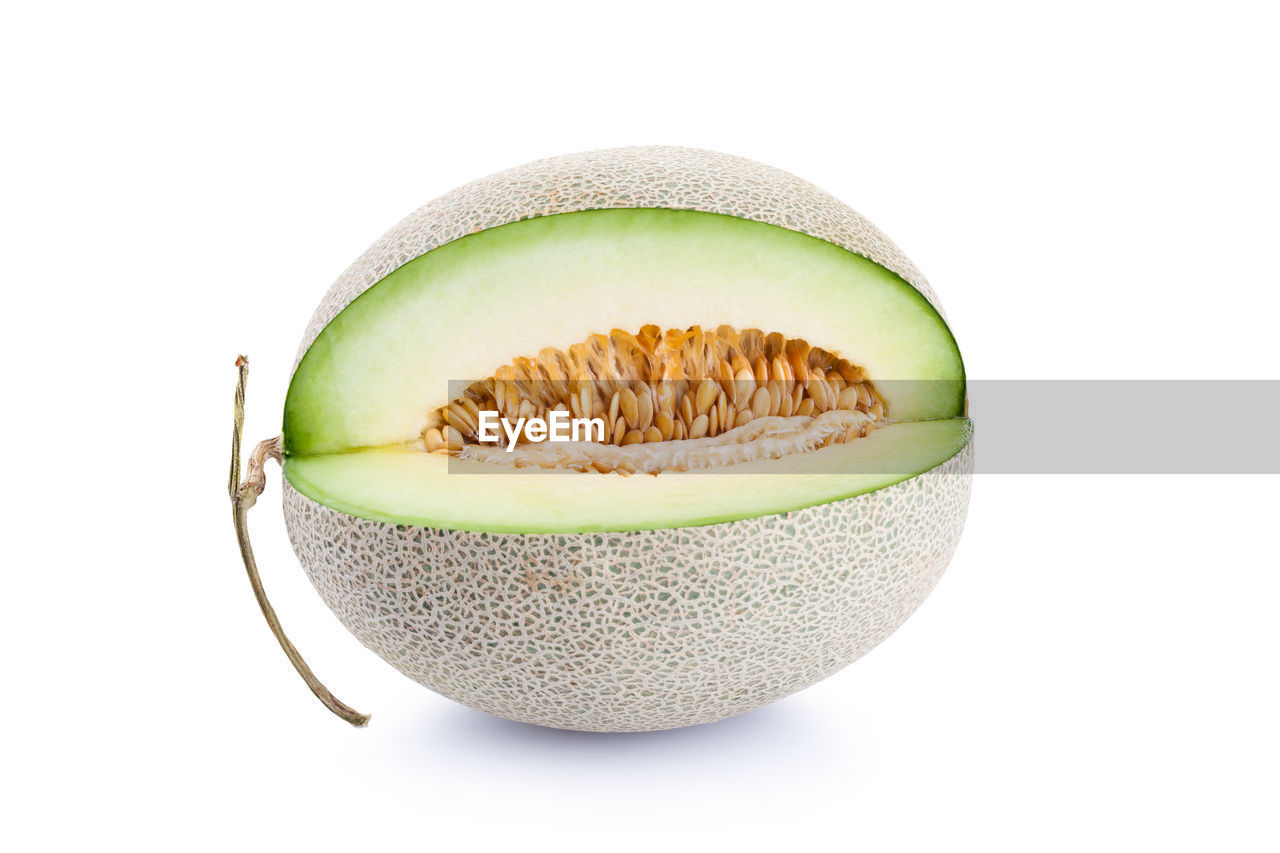 Close-up of melon against white background