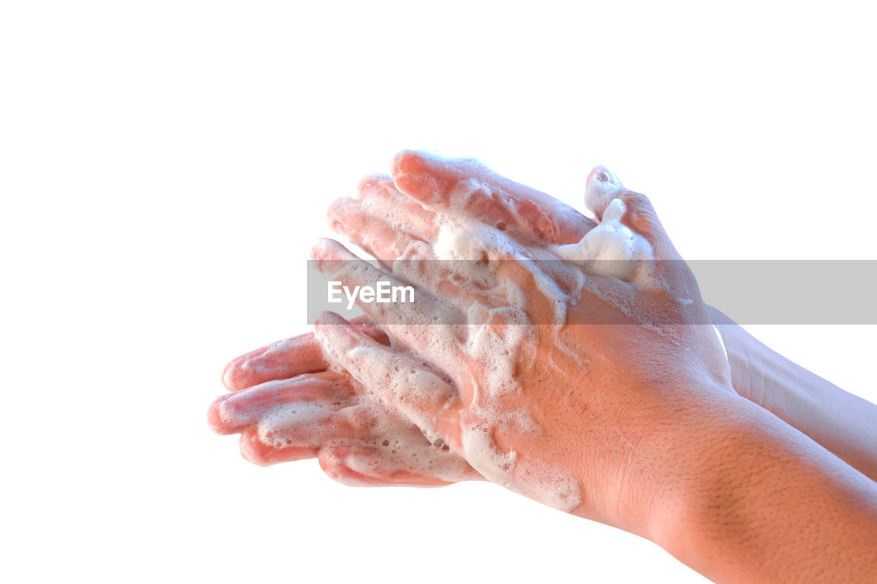 Closeup of person washing hands isolated on white background. coronavirus covid-19 concept.