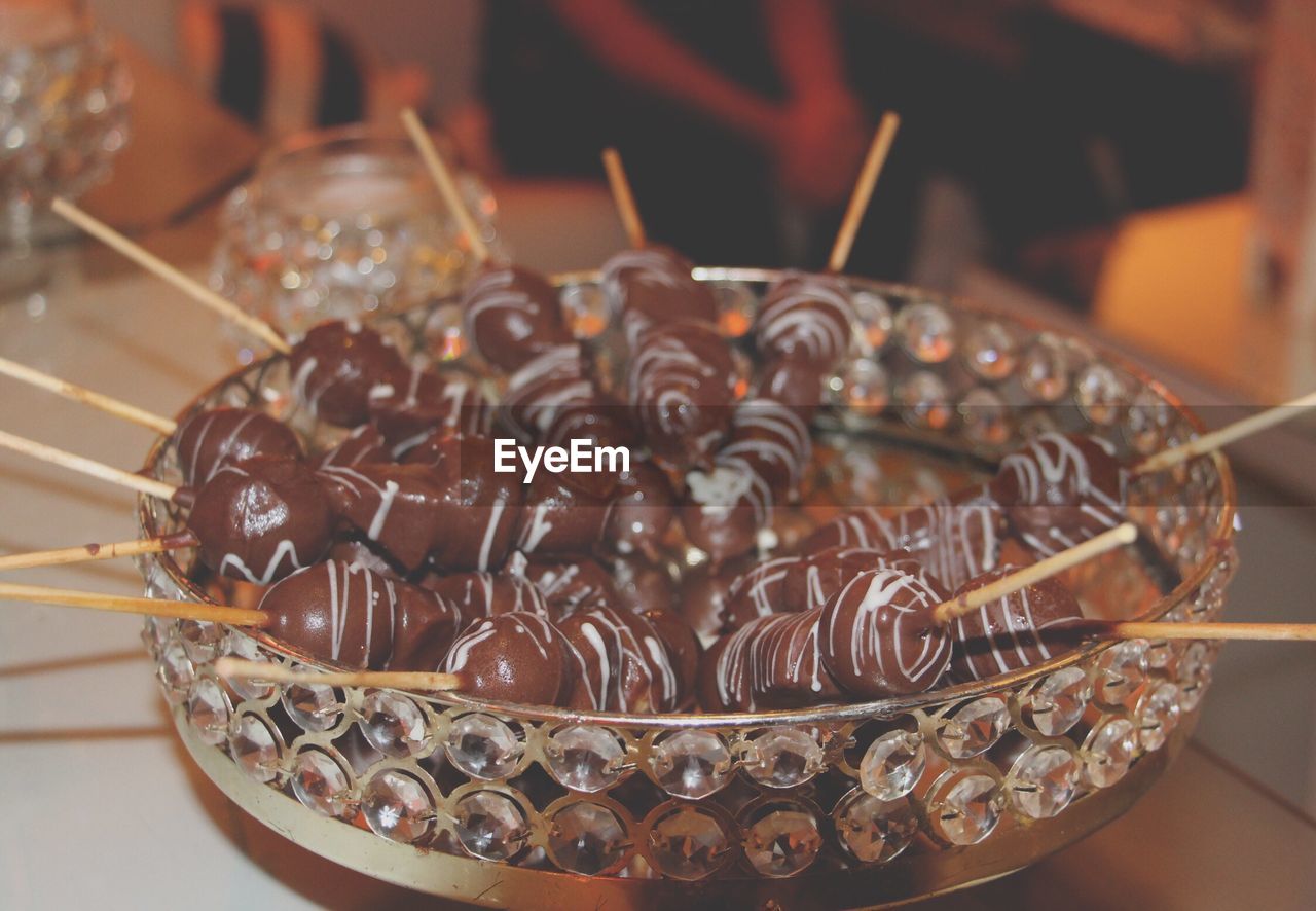 Close-up of desserts in glass plate on table