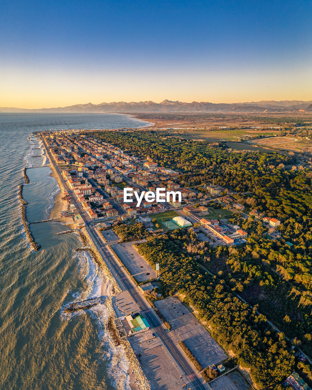 High angle view of land against sky during sunset