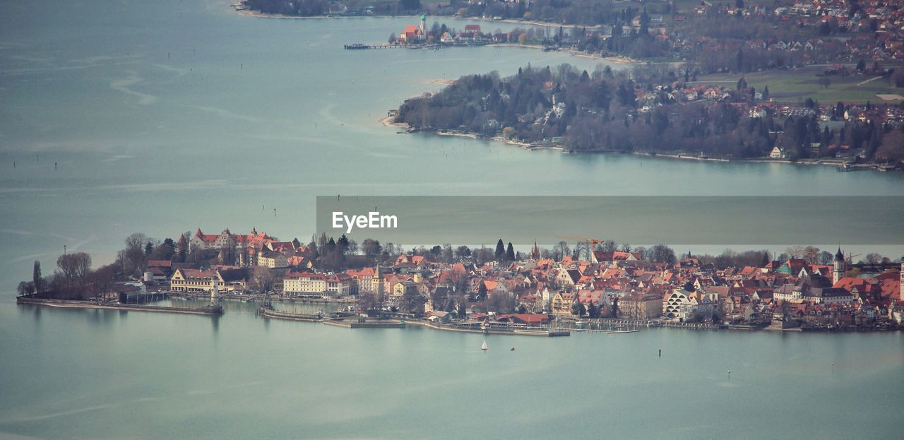 Panoramic view of river and cityscape against sky