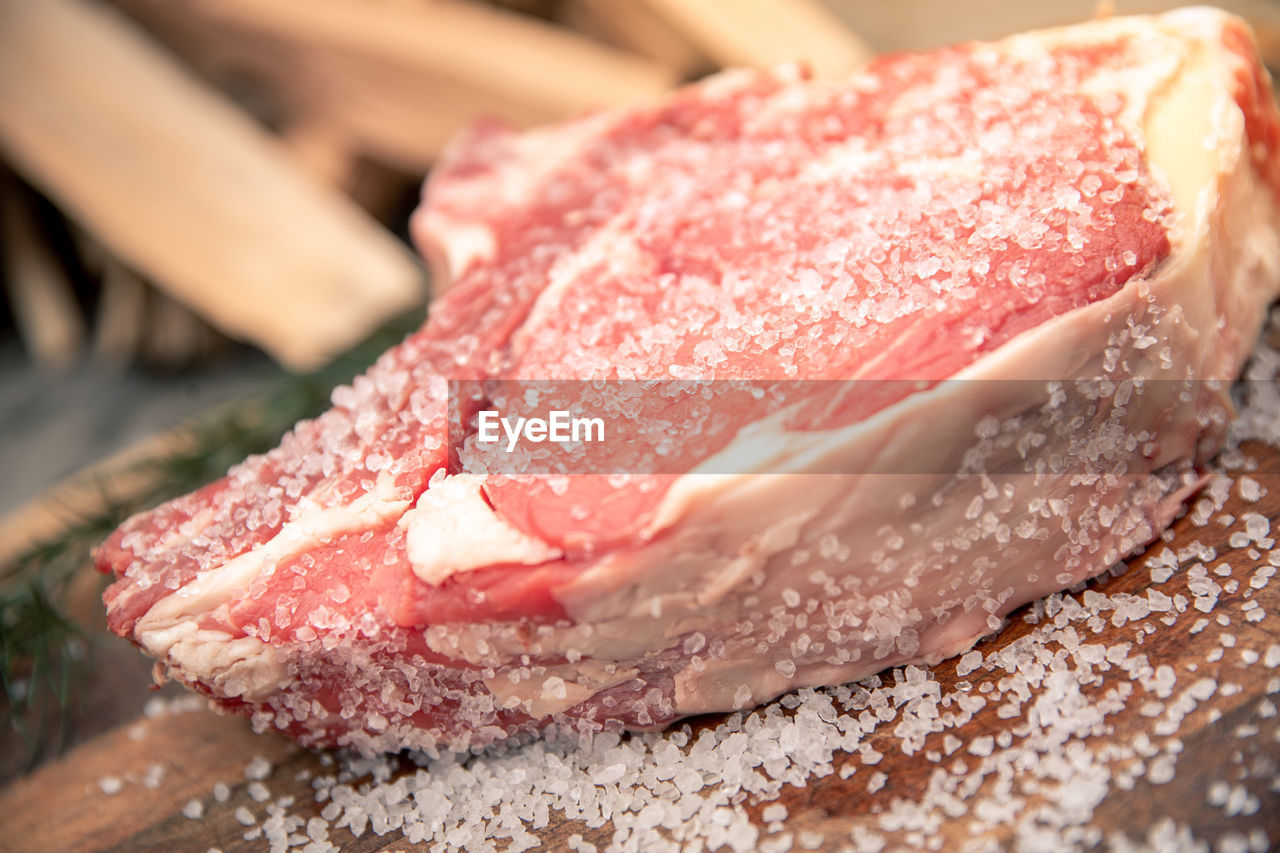 Italian steak ready to be cooked on a barbeque. appetizing piece of meat ready to be set on bbq fire