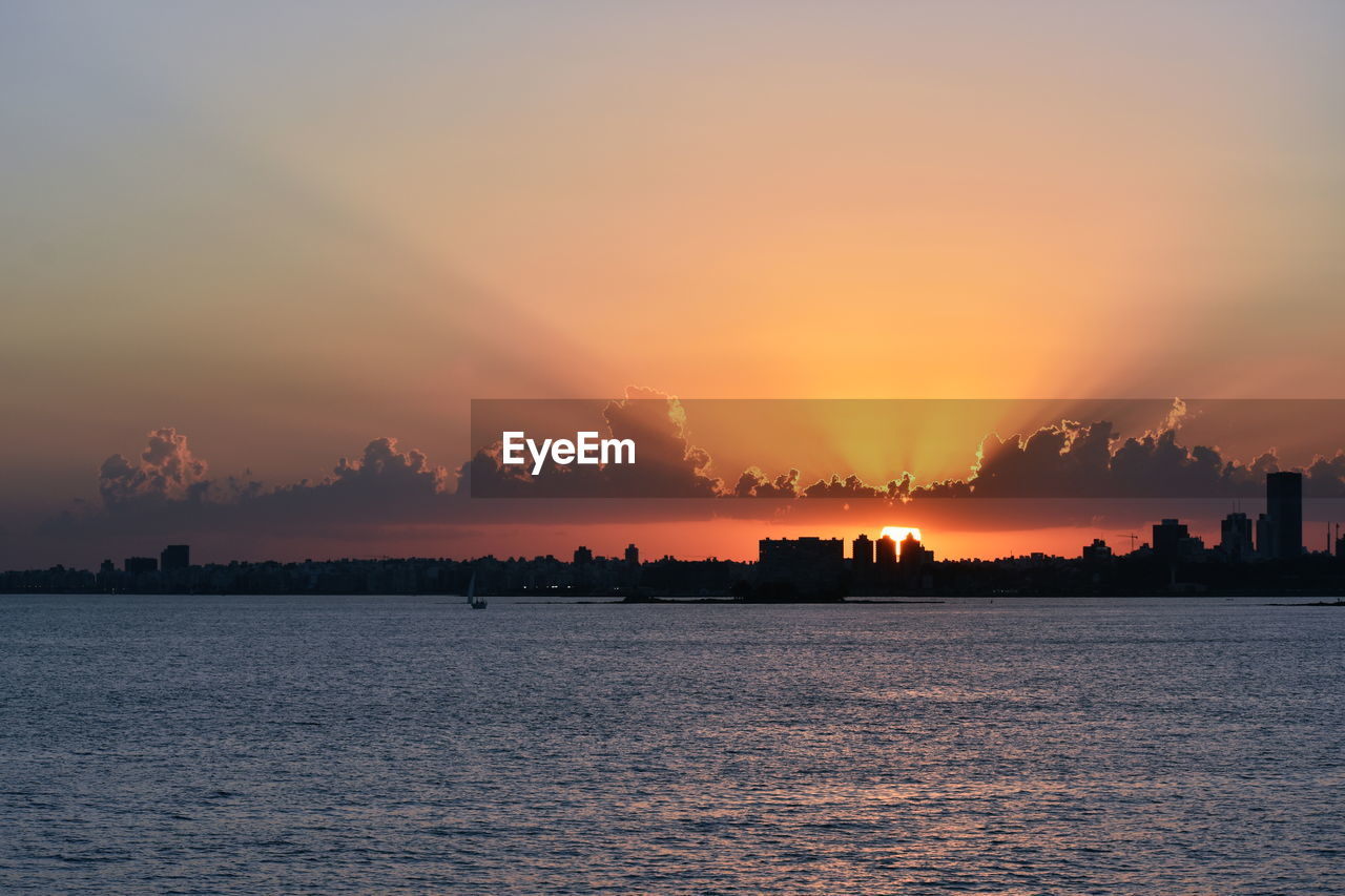 Scenic view of sea against sky during sunset