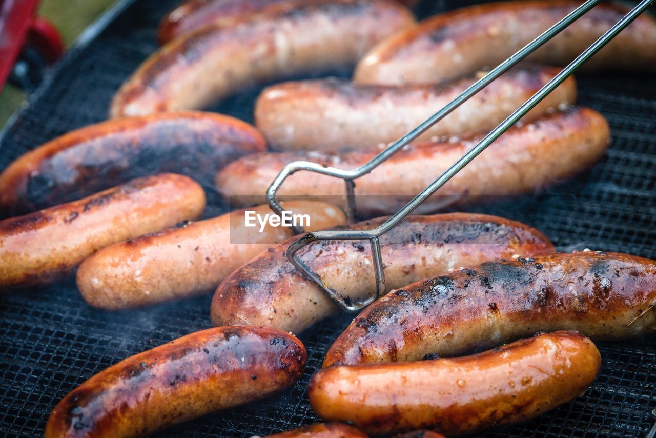 Close-up of sausages on barbecue grill