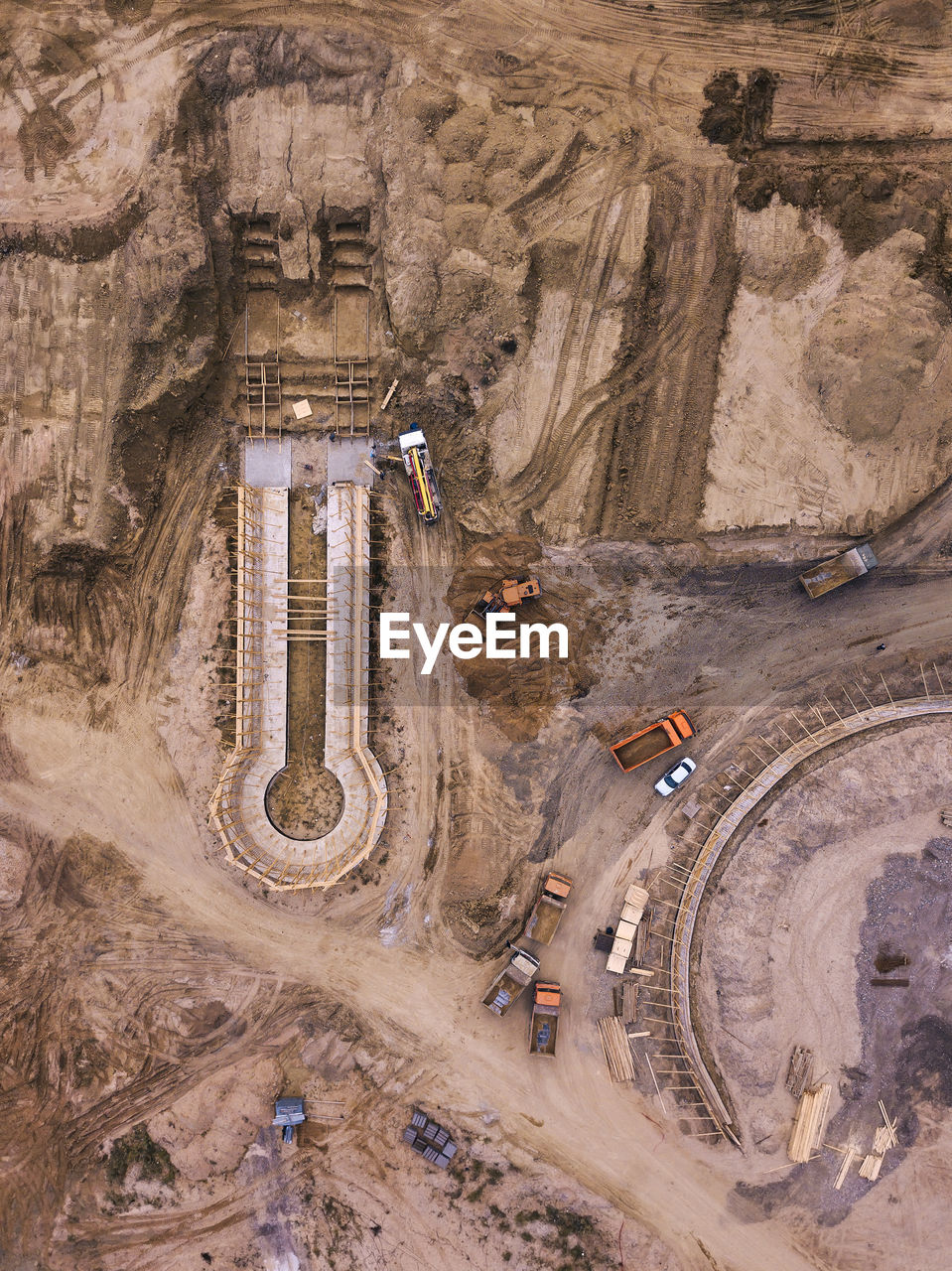 Russia, dagestan, derbent, aerial view of construction site in sandy area