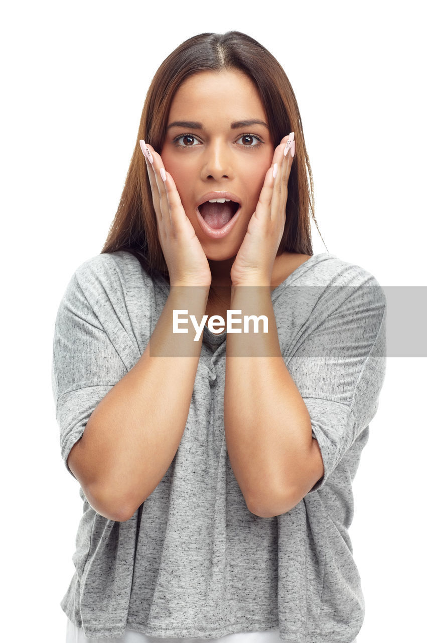 women, portrait, one person, white background, young adult, studio shot, adult, emotion, looking at camera, indoors, cut out, finger, casual clothing, waist up, female, clothing, front view, sleeve, relaxation, hand, hairstyle, positive emotion, happiness, brown hair, cute, long hair, smiling, facial expression, standing, surprise, human face, negative emotion, person, mouth open, photo shoot, outerwear, cheerful, looking, arm, copy space, lifestyles, fashion, human mouth