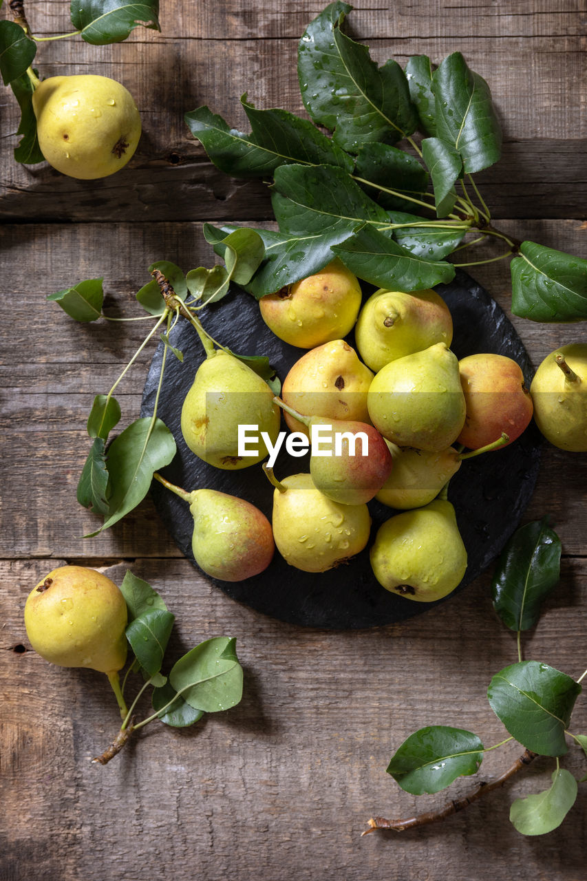 Organic healthy juicy ripe pear on a wooden kitchen table. the concept of diet menu. 