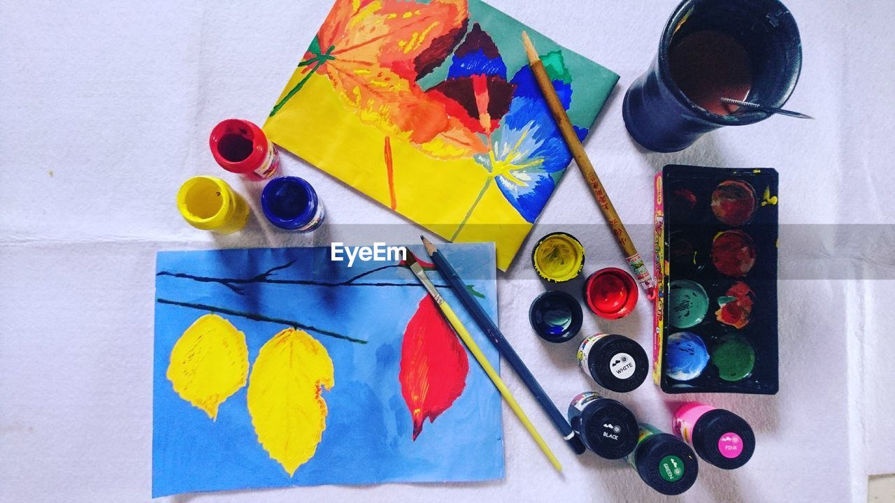 High angle view of watercolor paints on table