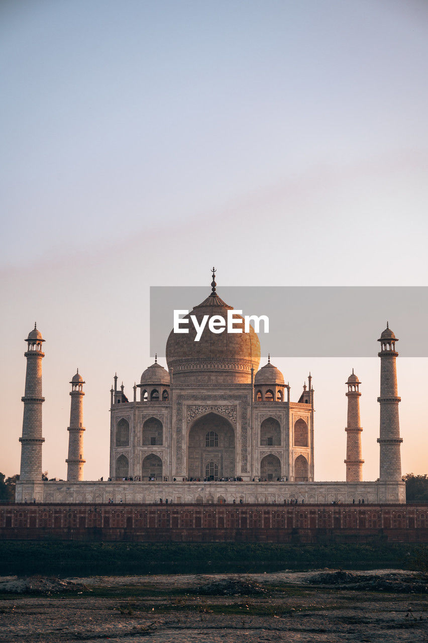 architecture, landmark, travel destinations, religion, built structure, dome, place of worship, building exterior, tower, travel, building, sky, history, nature, temple, the past, marble, tourism, city, water, sunset, brick, ancient, lighthouse, arch, reflection, outdoors, clear sky, evening, memorial, monument, calligraphy, no people