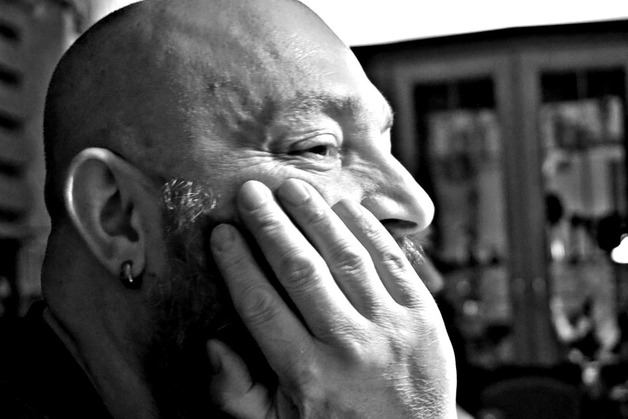 adult, portrait, one person, black and white, headshot, men, human face, monochrome, black, monochrome photography, hand, person, close-up, emotion, lifestyles, sadness, focus on foreground, human head, head in hands, depression - sadness, mature adult, architecture, leisure activity, shaved head, contemplation