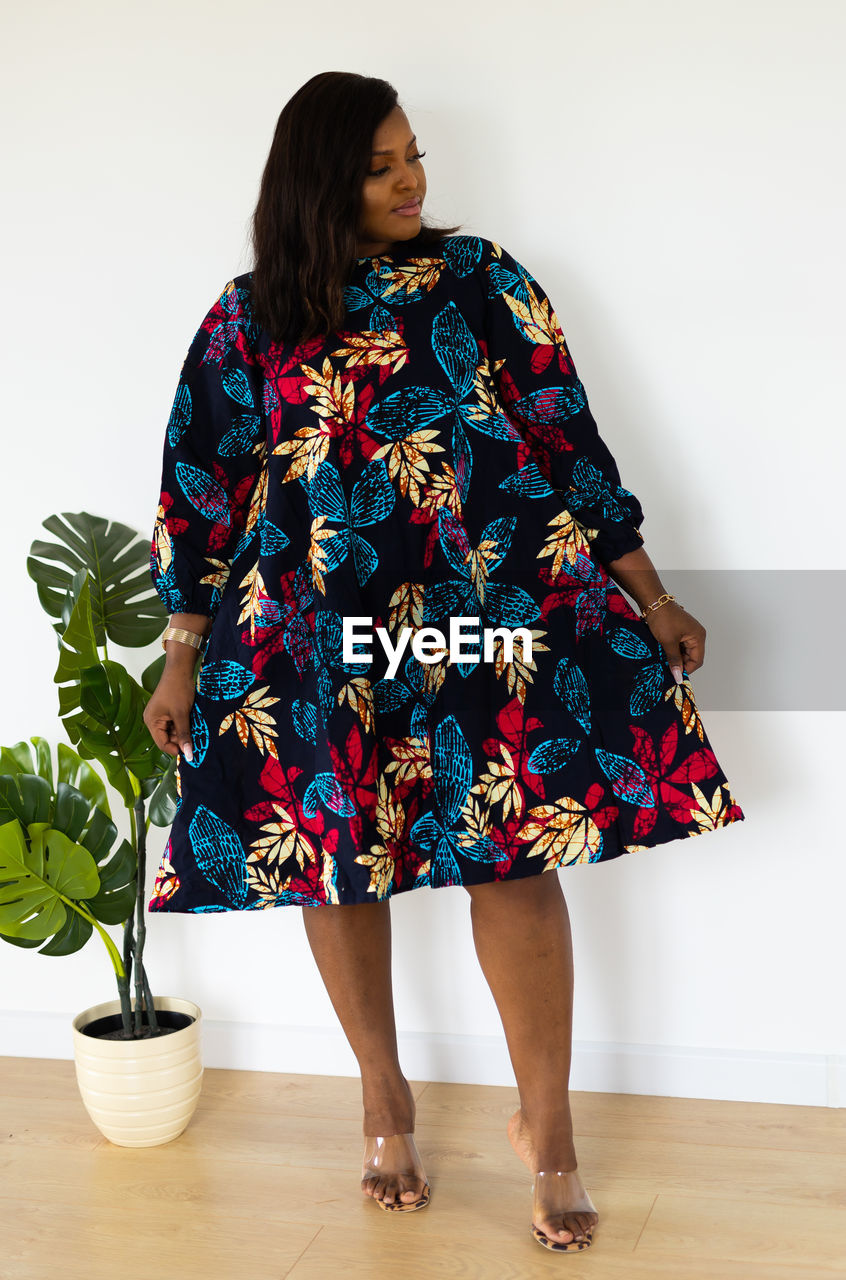 women, one person, adult, spring, full length, indoors, clothing, fashion, dress, pattern, flower, standing, flowerpot, female, young adult, houseplant, lifestyles, outerwear, plant, studio shot, sleeve, portrait, hairstyle, nature, photo shoot, person, potted plant