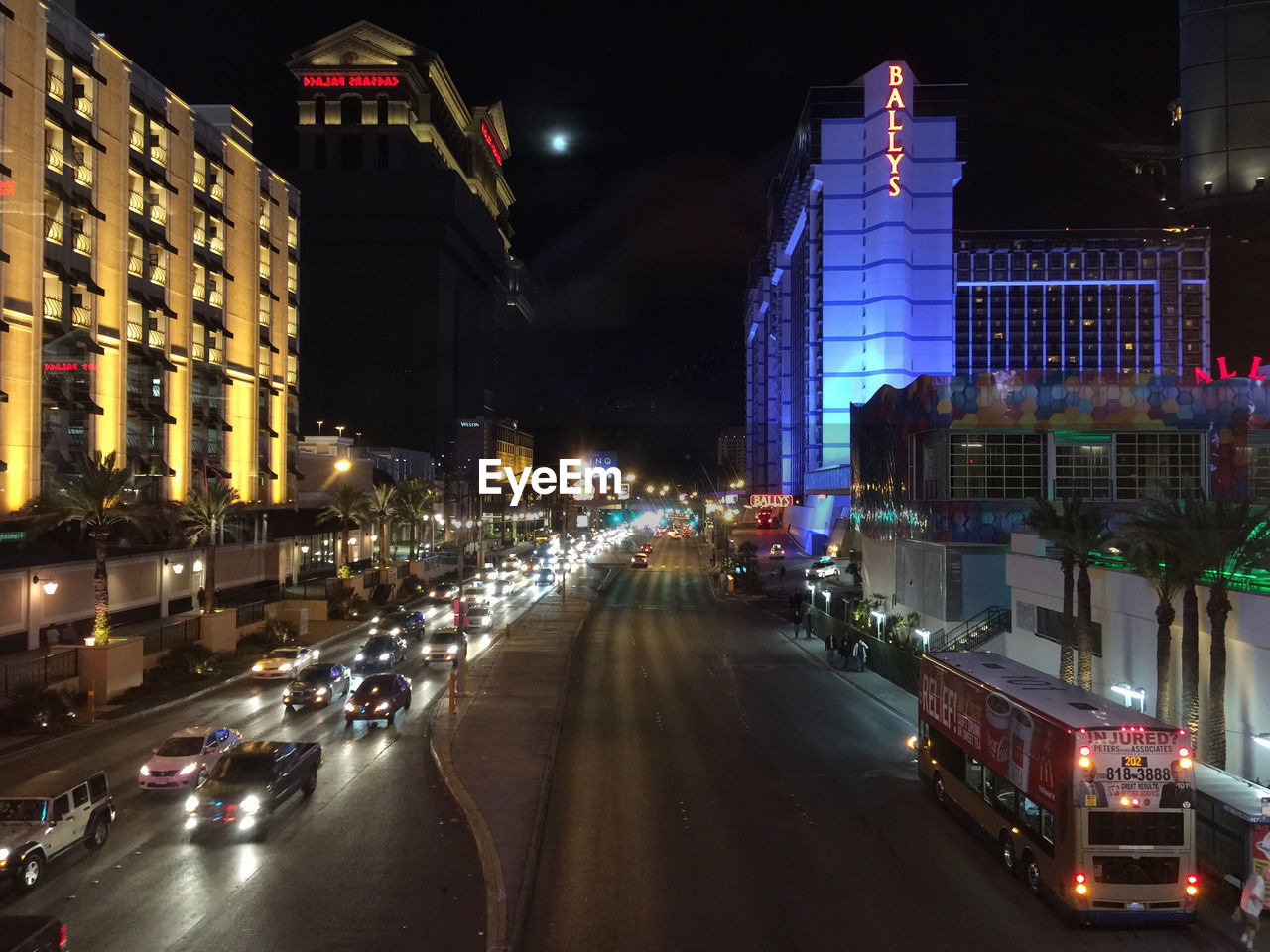 VIEW OF CITY STREET AT NIGHT