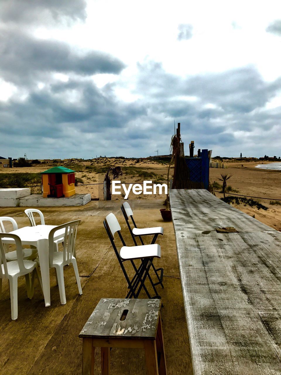 TABLES AND CHAIRS AGAINST SKY