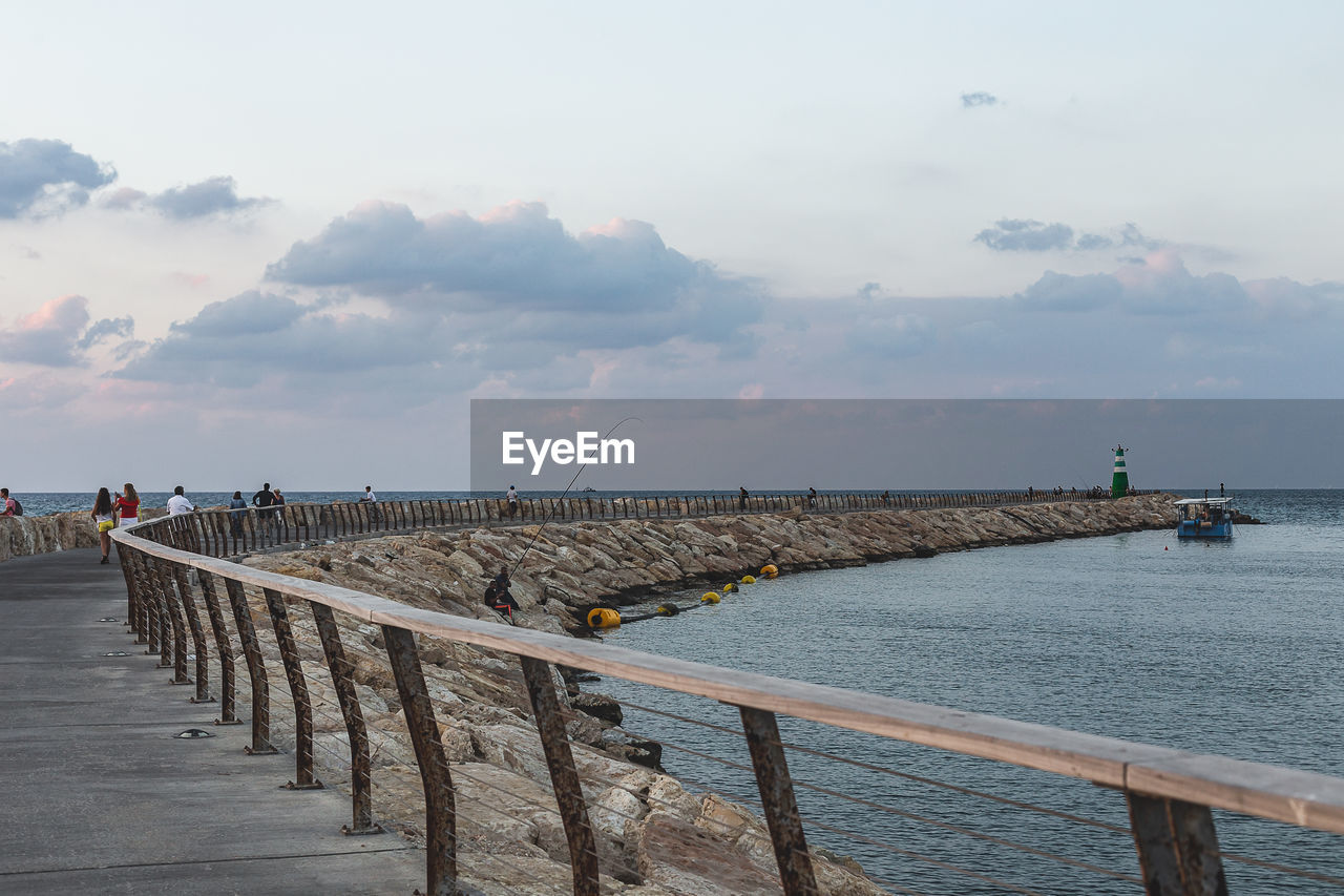 PIER AMIDST SEA AGAINST SKY