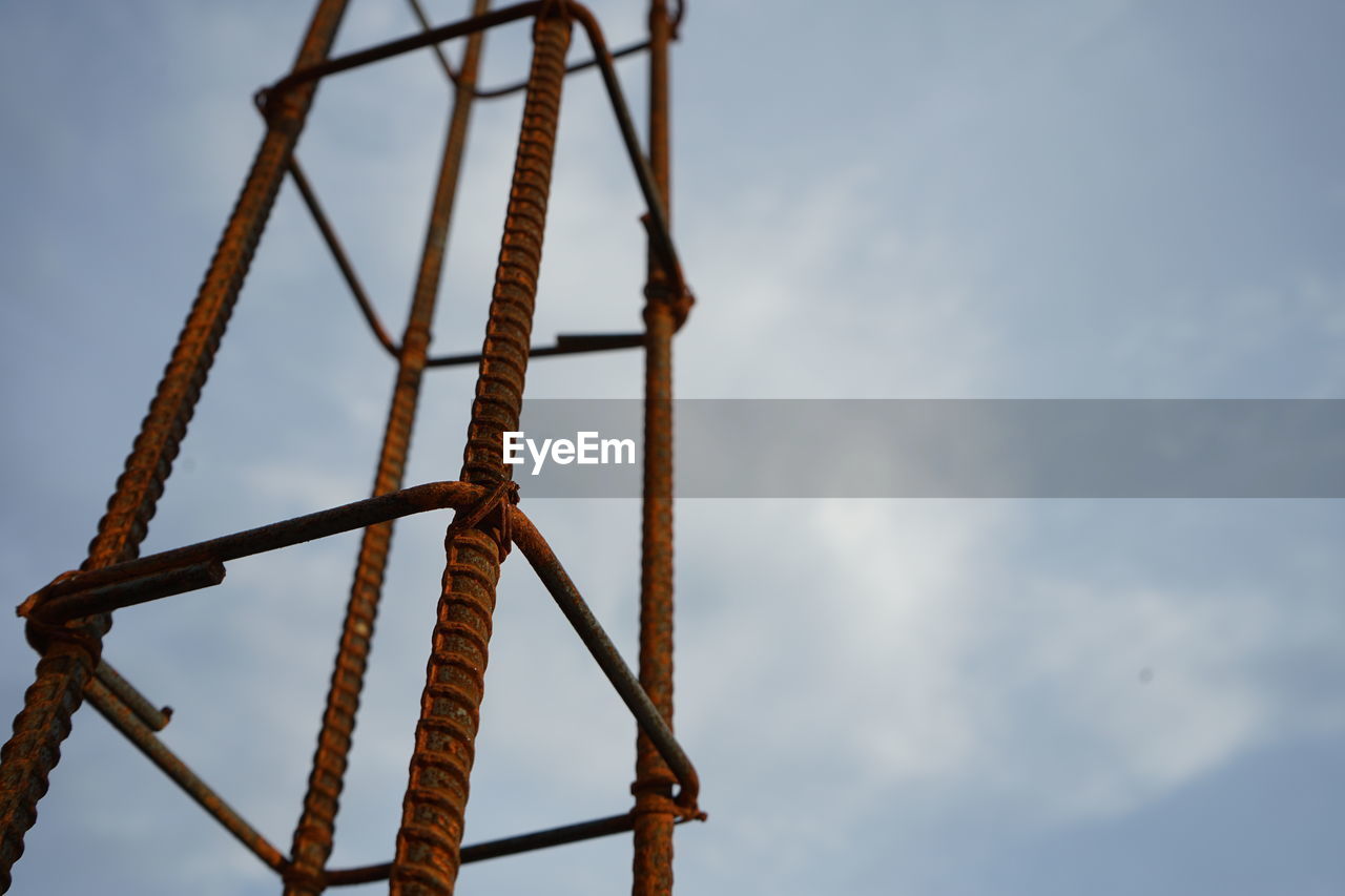 low angle view of metal against sky