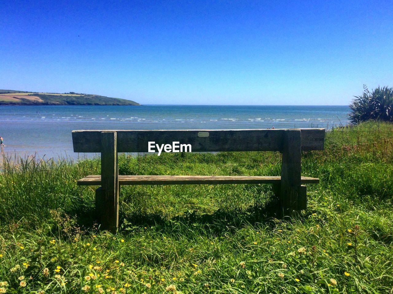 Scenic view of sea against clear blue sky