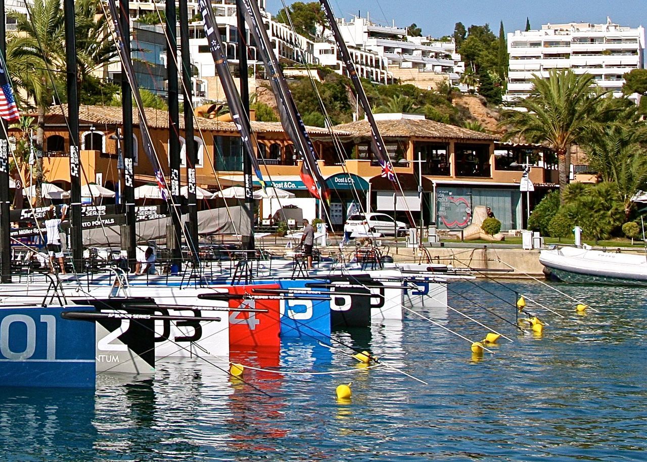 VIEW OF BOATS MOORED IN SEA