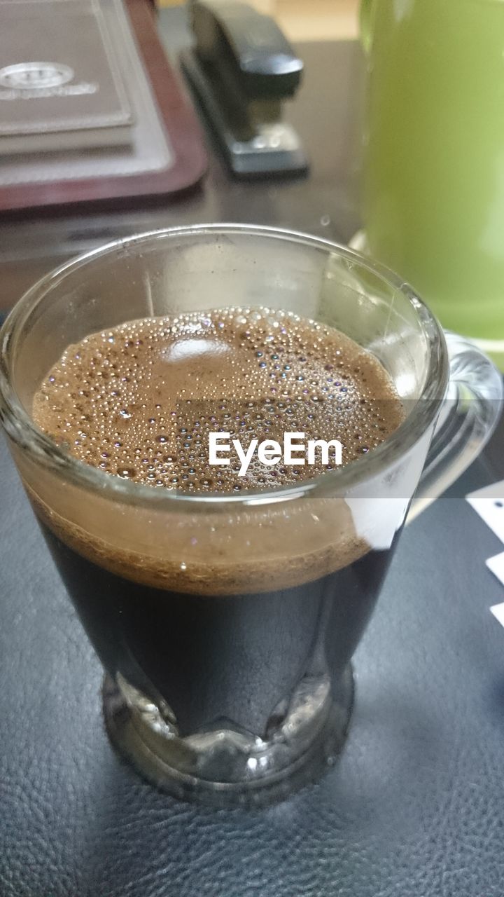 CLOSE-UP OF COFFEE ON TABLE