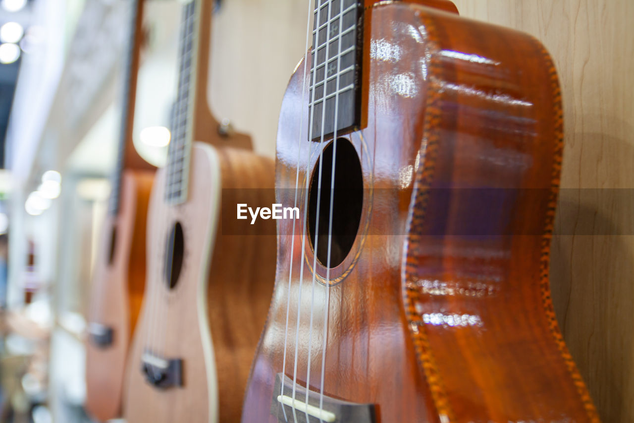 string instrument, musical instrument, music, guitar, musical equipment, arts culture and entertainment, acoustic guitar, indoors, plucked string instruments, string, wood, musical instrument string, no people, close-up, bowed string instrument, violin, selective focus