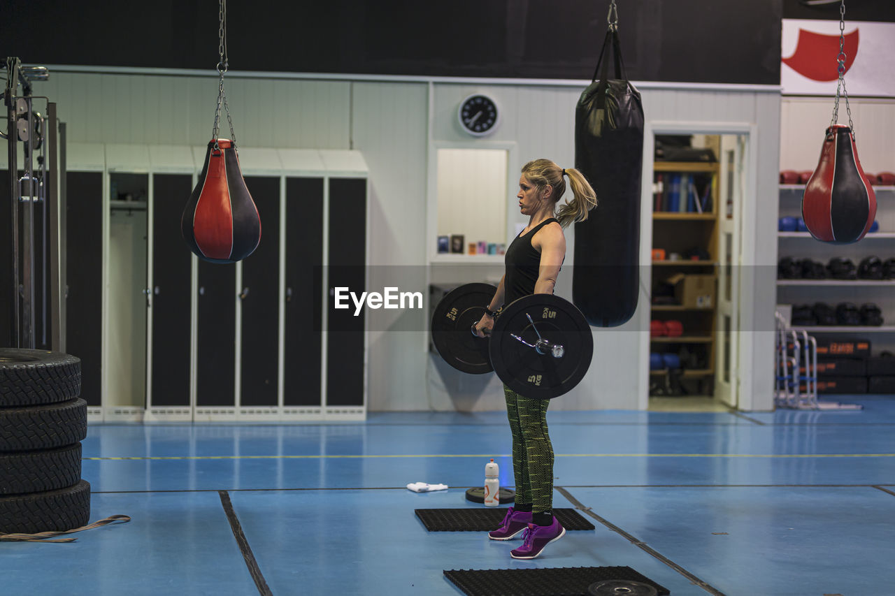 Woman weightlifting in gym