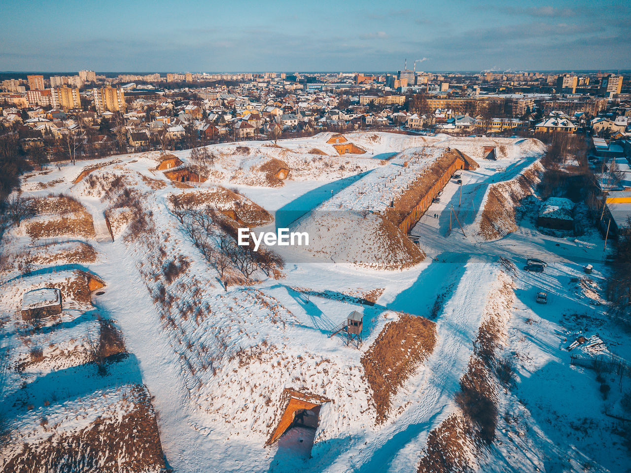 Aerial view of old ruin and buildings in city