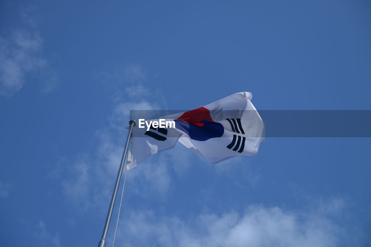 LOW ANGLE VIEW OF FLAGS FLAG AGAINST SKY