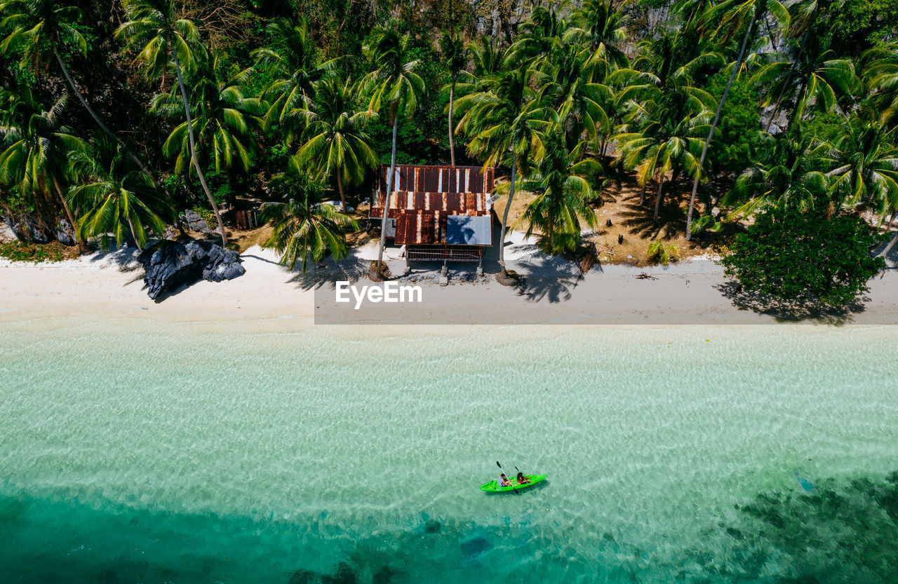 Drone view of couple at beach on sunny day